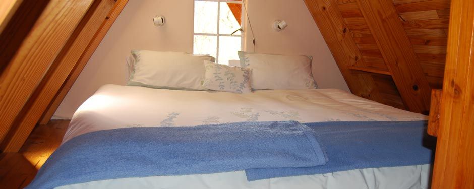 Loft bedroom of the A-frame cottage