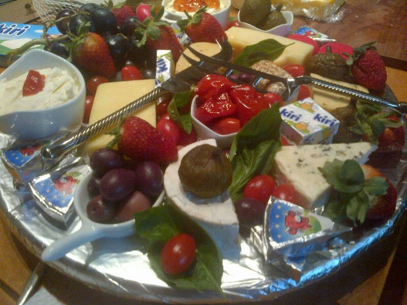 Cheese platter with a bottle of wine