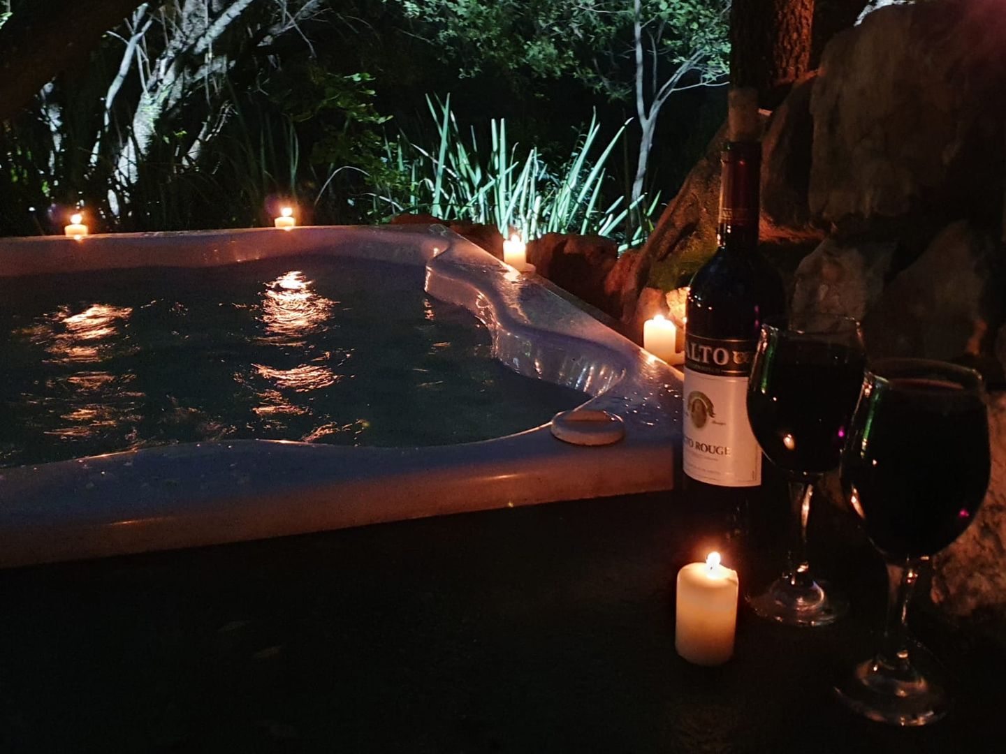 Two glasses of wine at a private jacuzzi